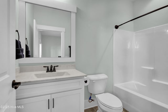 full bath featuring tub / shower combination, toilet, and vanity