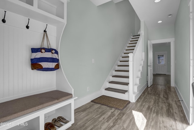 mudroom featuring visible vents, recessed lighting, baseboards, and wood finished floors