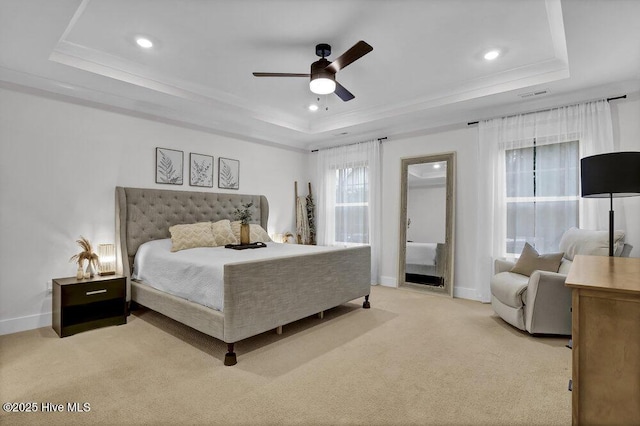 bedroom featuring visible vents, light carpet, a raised ceiling, recessed lighting, and baseboards