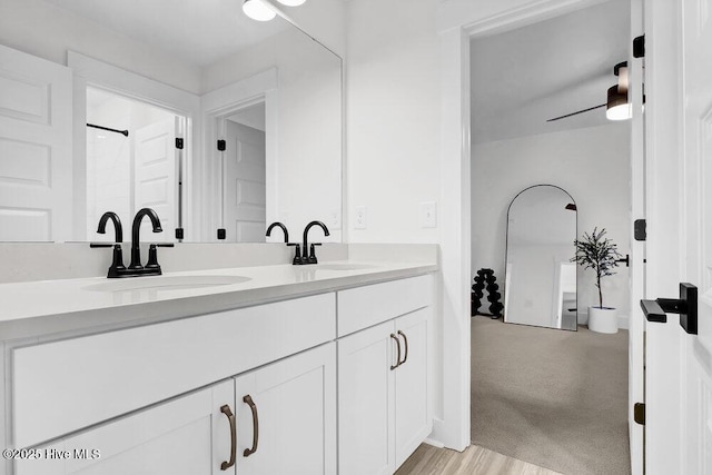 full bath with double vanity and a sink