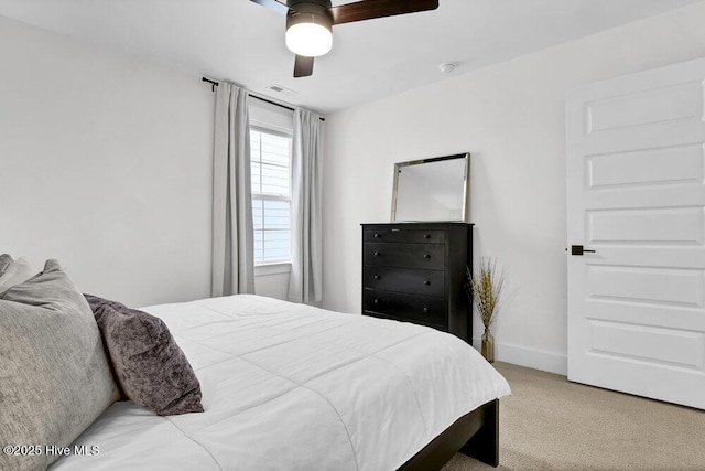 bedroom with visible vents, a ceiling fan, baseboards, and carpet floors