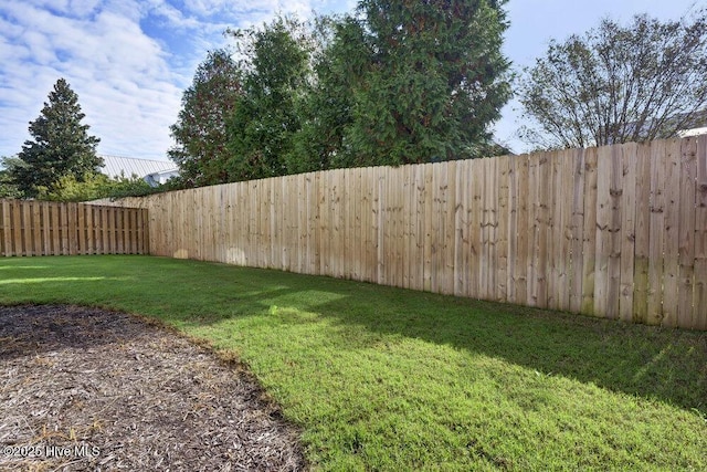 view of yard with a fenced backyard