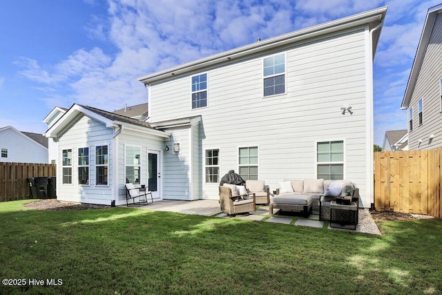 rear view of house featuring outdoor lounge area, a patio, a yard, and fence