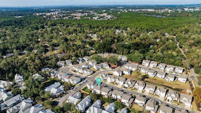 birds eye view of property with a residential view and a view of trees