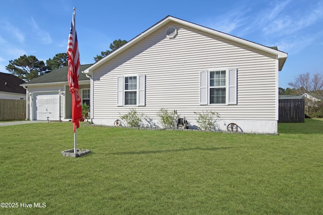 view of front of house with an attached garage, driveway, a front lawn, and fence