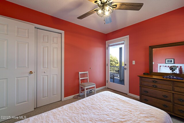 carpeted bedroom featuring access to exterior, a ceiling fan, baseboards, and a closet