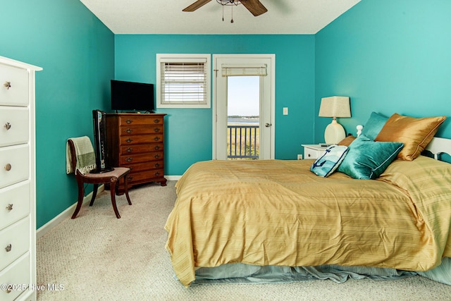 carpeted bedroom with baseboards, ceiling fan, and access to outside