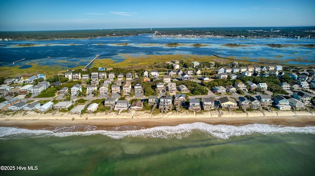 bird's eye view featuring a residential view, a beach view, and a water view