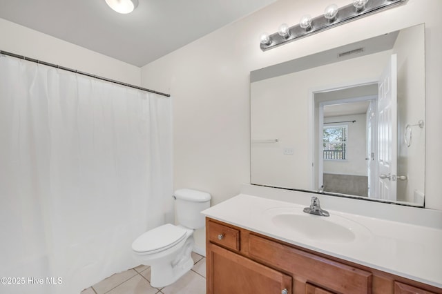 full bath with visible vents, toilet, a shower with shower curtain, tile patterned flooring, and vanity