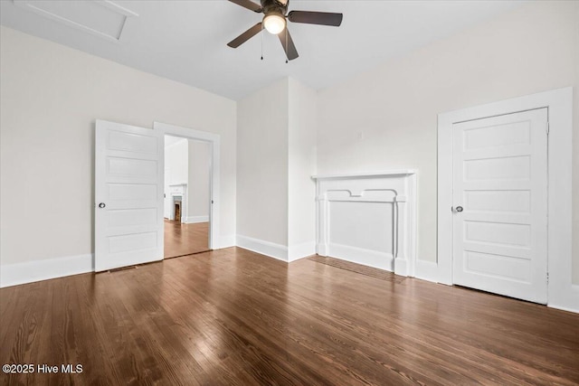 unfurnished living room with wood finished floors, baseboards, and ceiling fan