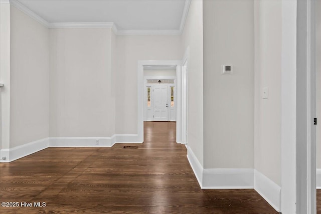 hall featuring crown molding, wood finished floors, and baseboards