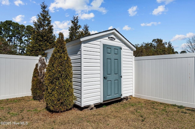 view of shed with a fenced backyard