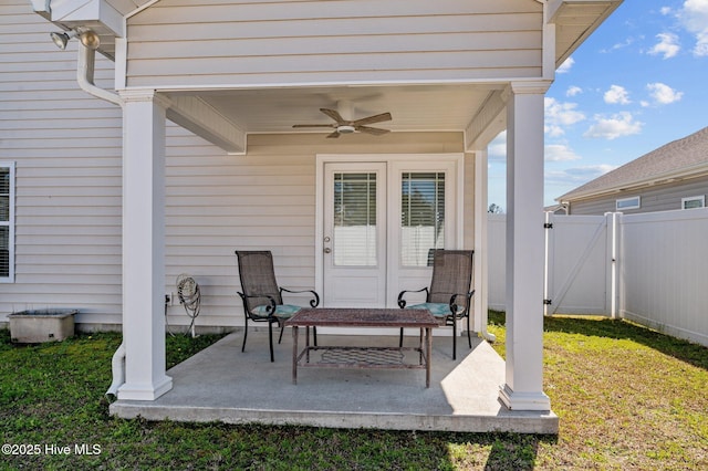 view of patio / terrace with a gate, ceiling fan, and fence