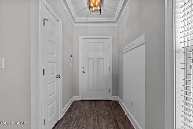 entryway featuring dark wood-type flooring, baseboards, and ornamental molding