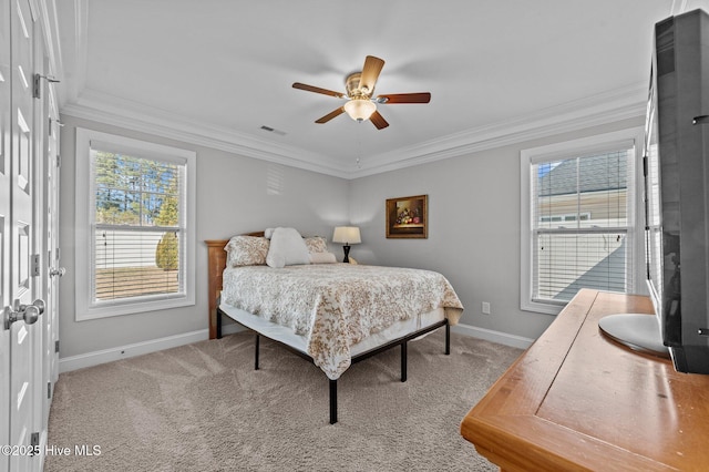 bedroom with visible vents, crown molding, baseboards, and carpet floors