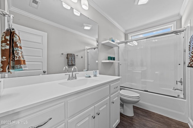 full bathroom with visible vents, crown molding, toilet, wood finished floors, and vanity