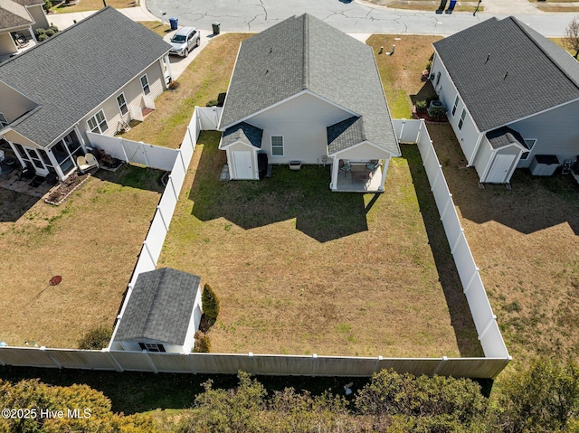 birds eye view of property with a residential view