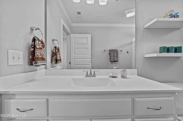 bathroom with vanity, visible vents, and ornamental molding