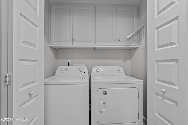 laundry room featuring washer and dryer and cabinet space