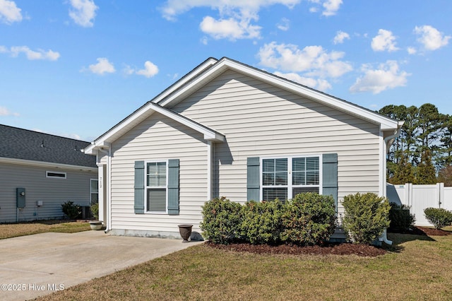 bungalow-style house featuring a front yard, fence, and a patio area