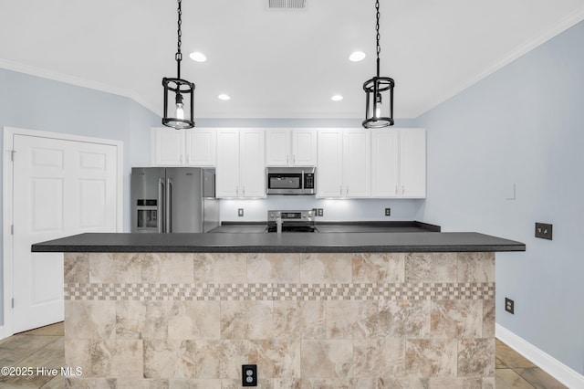 kitchen featuring dark countertops, stainless steel appliances, and crown molding