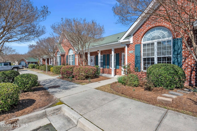 exterior space with brick siding