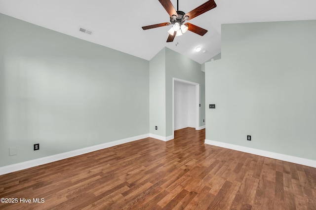 unfurnished room with visible vents, baseboards, ceiling fan, wood finished floors, and high vaulted ceiling