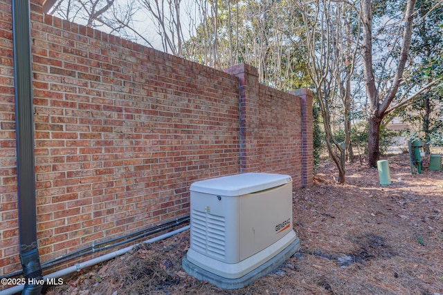 exterior details featuring a power unit and brick siding