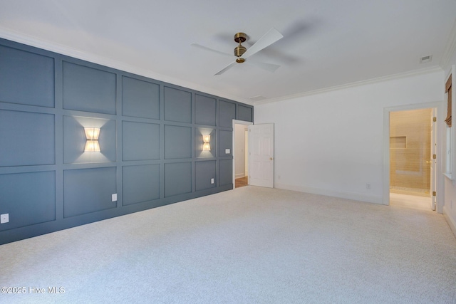 interior space featuring a decorative wall, visible vents, and ceiling fan