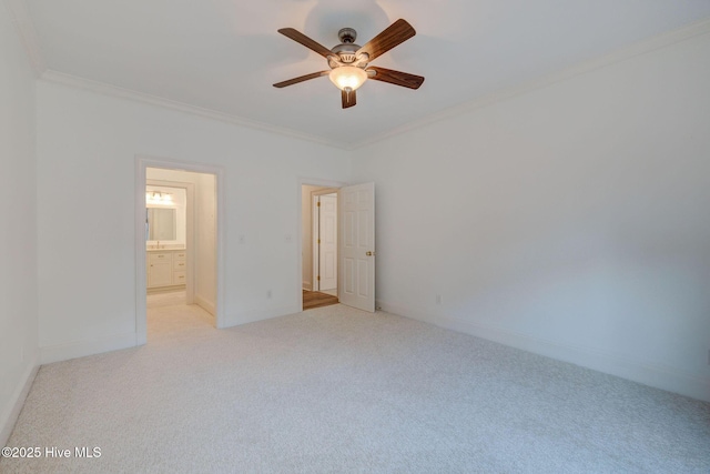 unfurnished bedroom featuring a ceiling fan, light colored carpet, baseboards, and ornamental molding