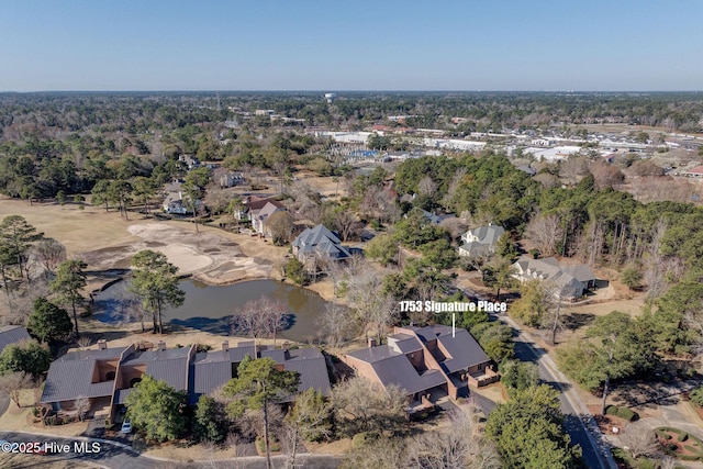 drone / aerial view featuring a residential view and a water view