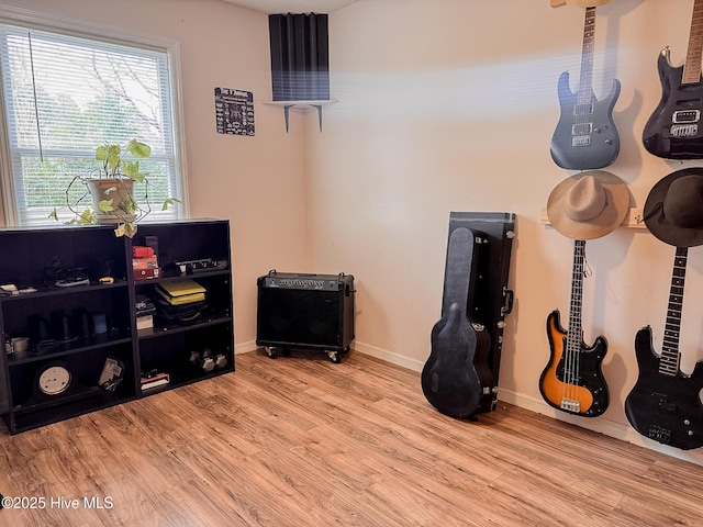 interior space featuring wood finished floors and baseboards