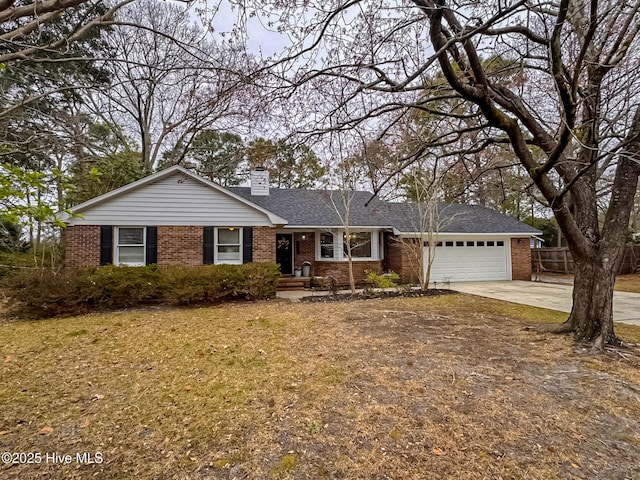 ranch-style home featuring brick siding, concrete driveway, a garage, and fence