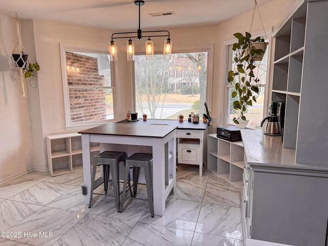 dining area with visible vents and marble finish floor