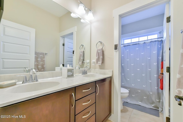 bathroom with a shower with shower curtain, double vanity, toilet, and a sink