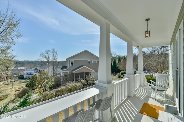 balcony with a porch and a residential view