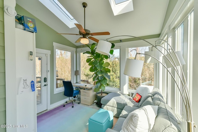 sunroom / solarium featuring vaulted ceiling with skylight and a ceiling fan