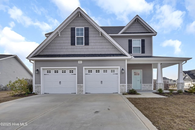 craftsman-style house featuring stone siding, a porch, concrete driveway, and a garage