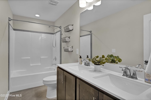 full bathroom featuring tile patterned flooring, visible vents, bathing tub / shower combination, and a sink