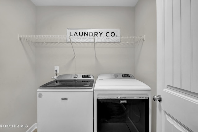 washroom featuring laundry area and washer and dryer