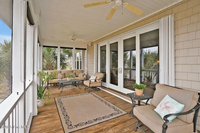 sunroom with an outdoor living space, french doors, and ceiling fan