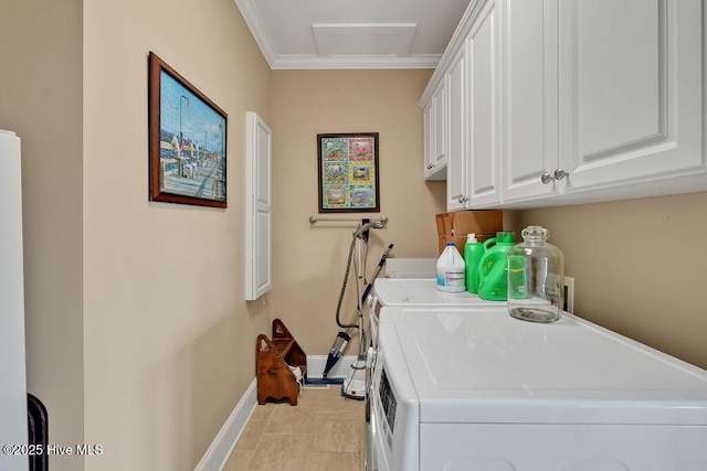 clothes washing area featuring independent washer and dryer, attic access, baseboards, ornamental molding, and cabinet space