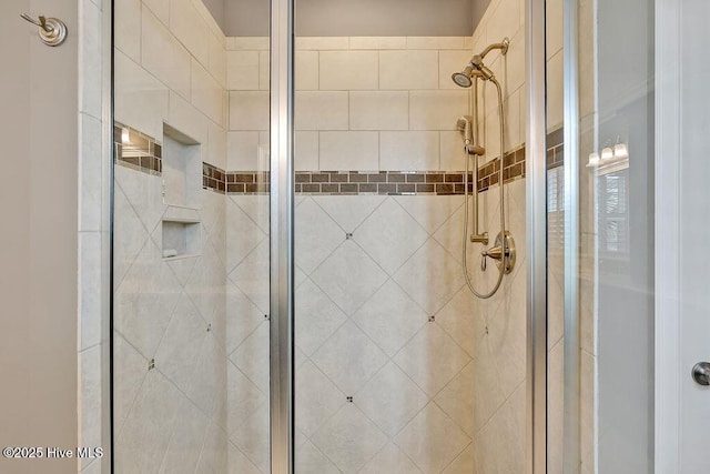 full bath with a shower stall