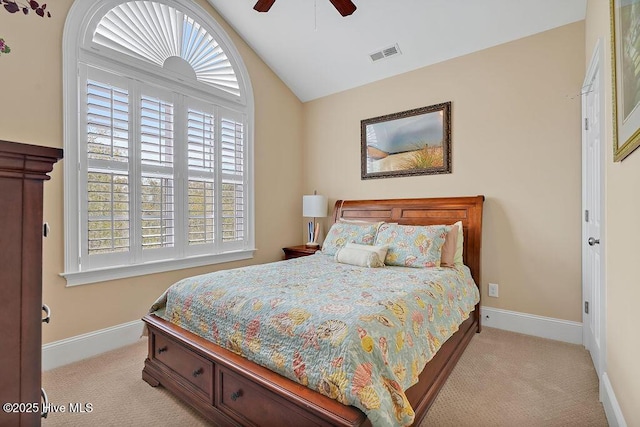 bedroom with lofted ceiling, carpet, baseboards, and visible vents