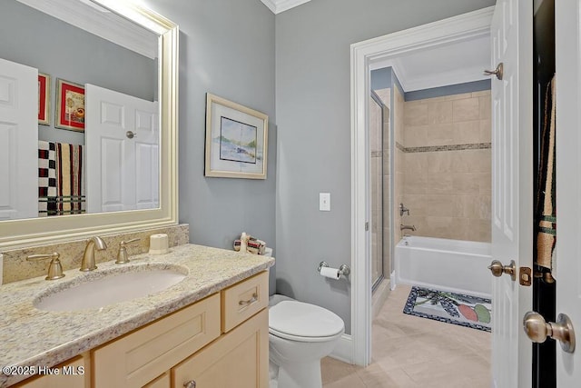 bathroom with toilet, crown molding, baseboards, tile patterned flooring, and vanity