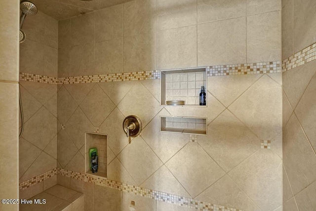 full bath featuring a tile shower