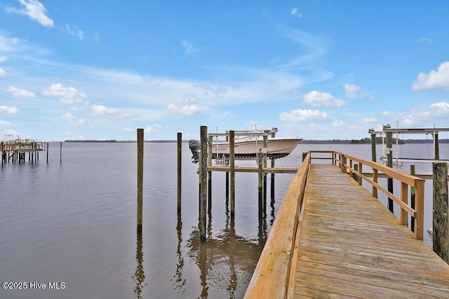view of dock with a water view and boat lift