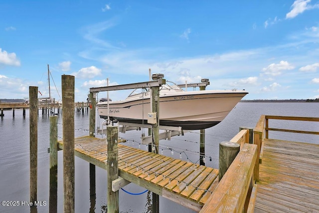 view of dock featuring a water view and boat lift