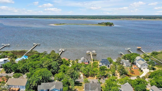 bird's eye view featuring a water view and a residential view