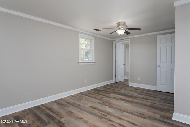 unfurnished bedroom featuring wood finished floors, baseboards, and ornamental molding